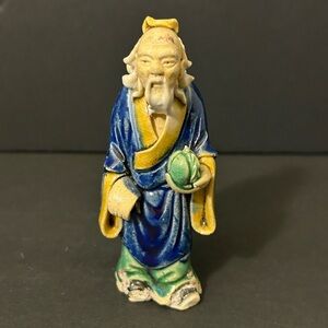 Vintage 4 1/8” Tall Chinese Handcrafted Mud(?) Man Figurine Holding Pot(?)